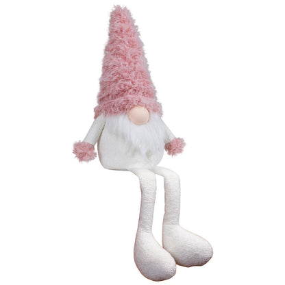 Wichtel als Kantenhocker mit einer rosa Zottelmütze. Im weißen Fellbart sind dezente Silbersträhnen eingearbeitet. Dadurch bekommt er eine außergewöhnliche Erscheinung. Höhe: ca. 45 cm - Material: Stoff, Fell - Farben: rosa, weiß, silber