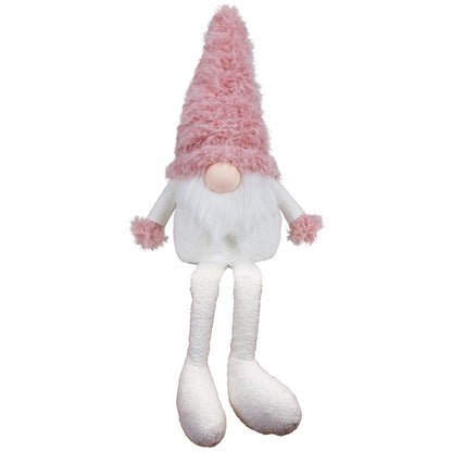 Wichtel als Kantenhocker mit einer rosa Zottelmütze. Im weißen Fellbart sind dezente Silbersträhnen eingearbeitet. Dadurch bekommt er eine außergewöhnliche Erscheinung. Höhe: ca. 45 cm - Material: Stoff, Fell - Farben: rosa, weiß, silber