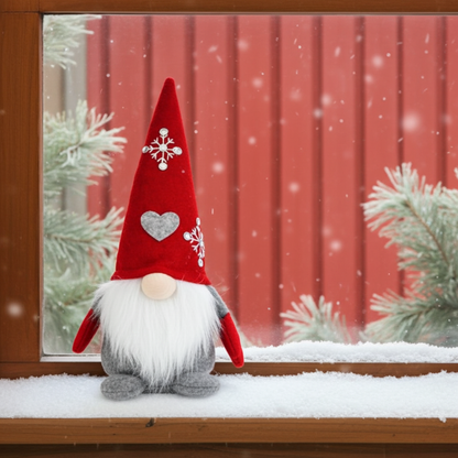 Wichtel - Santa sitzend mit Herz auf der Mütze, sowie gestickter Schneeflocke mit Strasssteinen. Der Wichtel besteht aus einem strapazierfähigen Filz mit einer Holznase . Höhe: ca. 23 cm - 
Gewicht: ca. 200 g - Applikationen: Gestickte Schneeflocke mit Strasssteinen - Material: Filz, Holz, Strasssteine - Farben: rot, weiß, grau